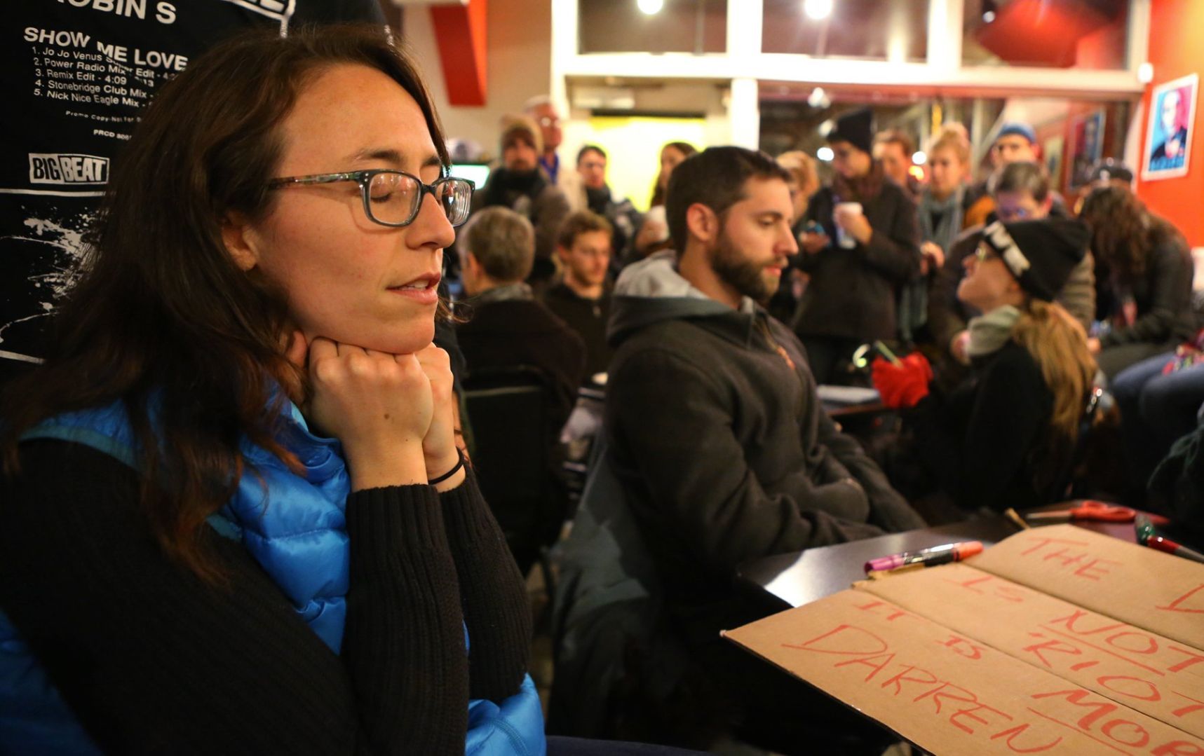 Patrons at Mokabe's listen to the Wilson announcement